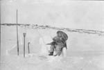 Inuit woman fishing