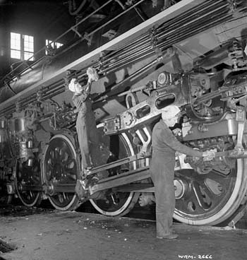 women cleaning locomotive